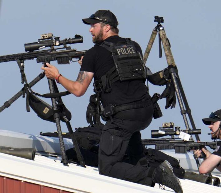 Police snipers return fire after shots were fired while Republican presidential candidate former President Donald Trump was speaking at a campaign event in Butler, Pa., on Saturday, July 13, 2024. (AP Photo/Gene J. Puskar)